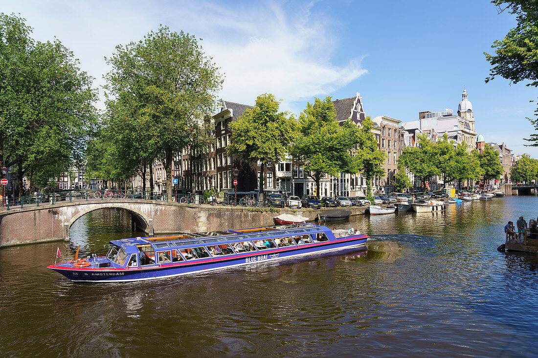Tourist boat on a canal, Amsterdam, North Holland, The Netherlands, Europe