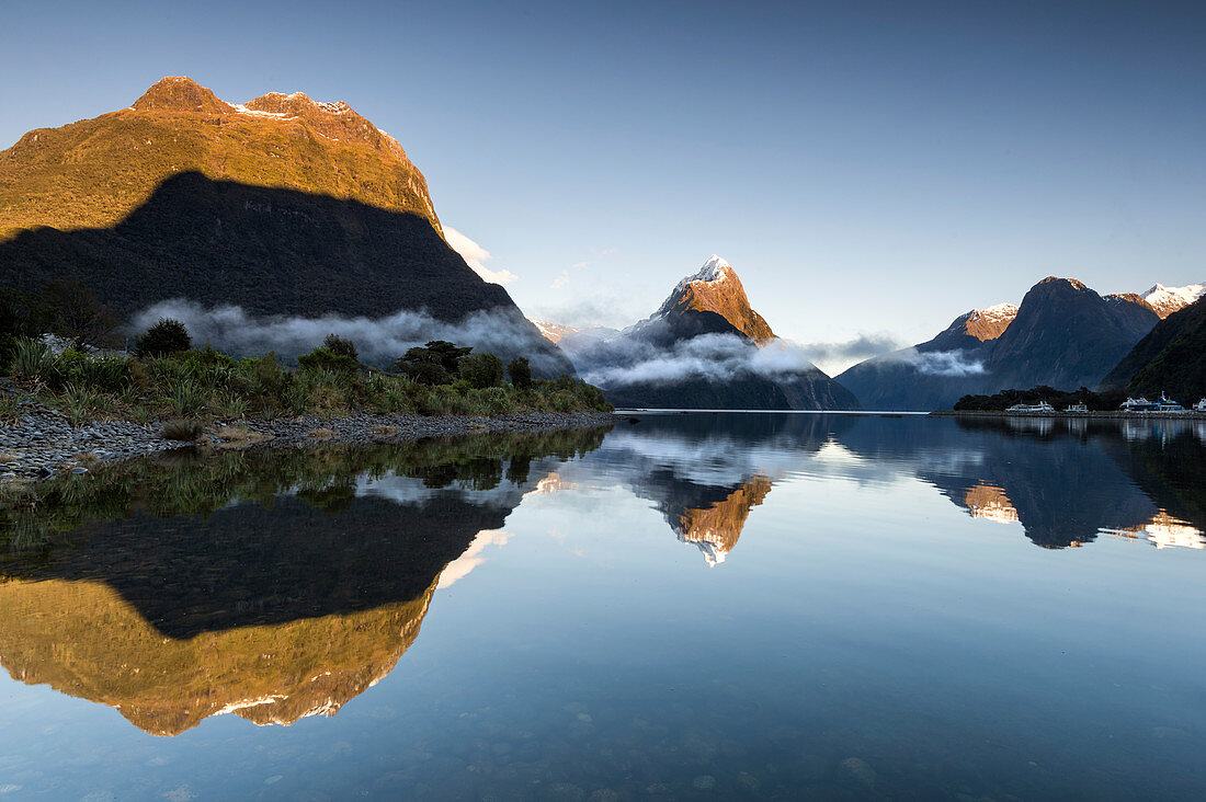 Low cloud lying below Mitre Peak at Milford Sound, Fiordland National Park, UNESCO World Heritage Site, South Island, New Zealand, Pacific