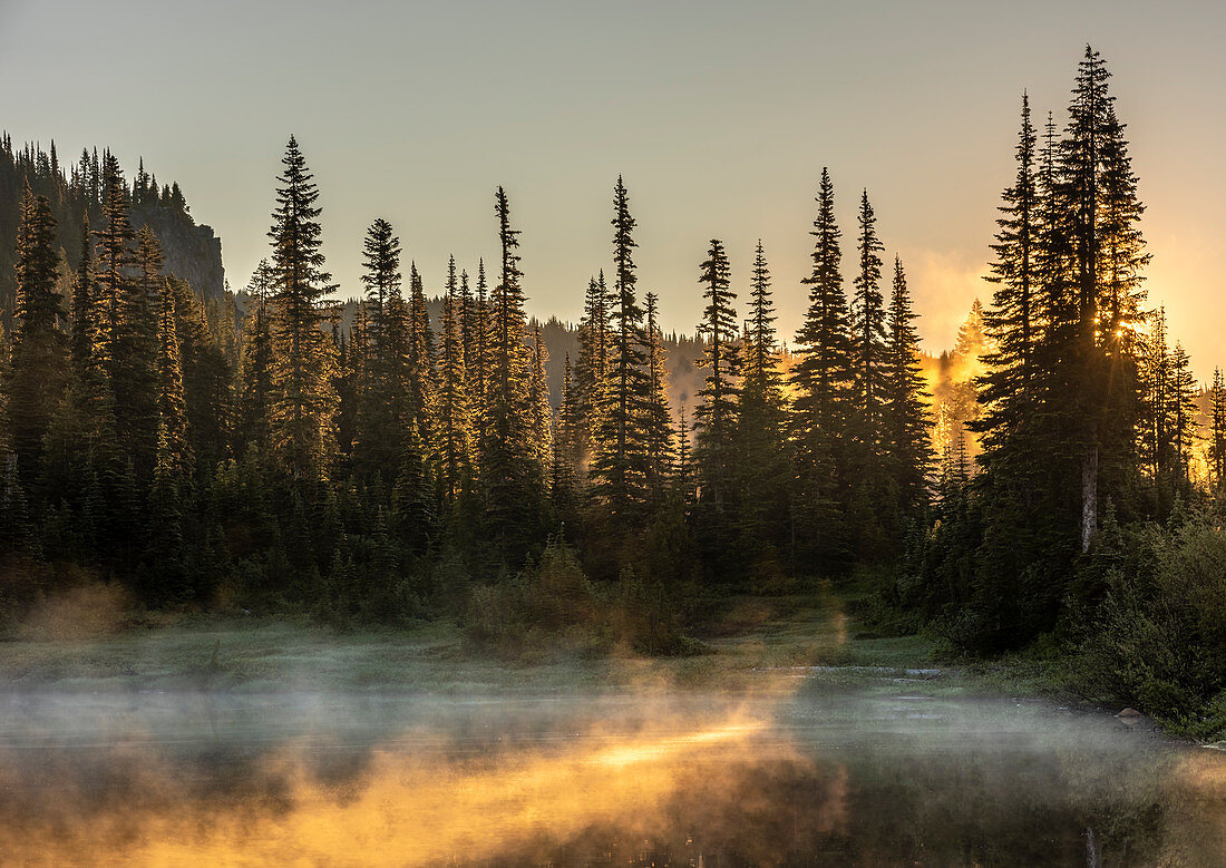 Morning sunlight and mist, Reflection Lake, Mount Rainier National Park, Washington State, United States of America, North America