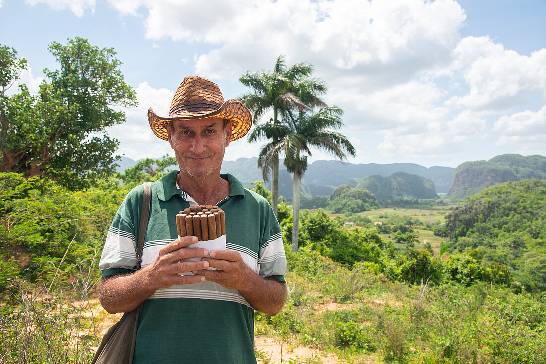 Local man selling Cuban cigars in Vinales, UNESCO World Heritage Site, Cuba, West Indies, Caribbean, Central America