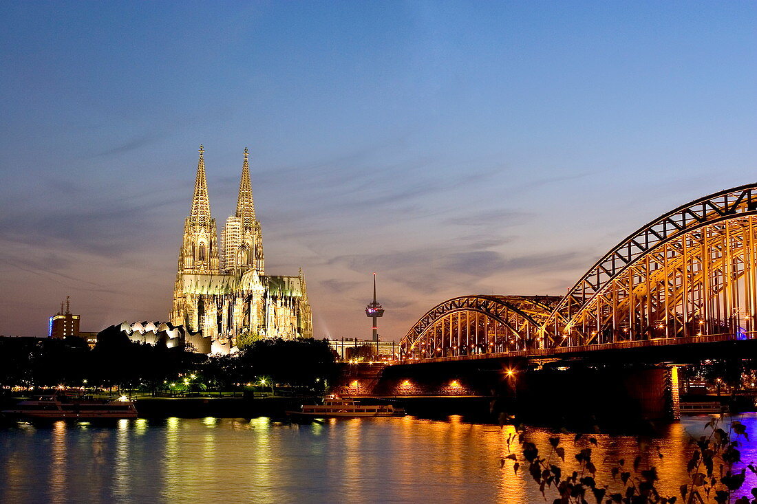 Cologne cathedral and Hohenzollern bridge at night, Cologne, North Rhine Westphalia, Germany, Europe