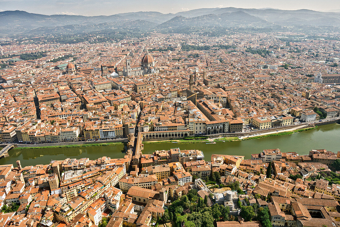Aerial view of Florence with in the foreground Ponte Vecchio, Palazzo Vecchio and Cattedrale di Santa Maria del Fiore, Florence, Tuscany, Italy, Europe