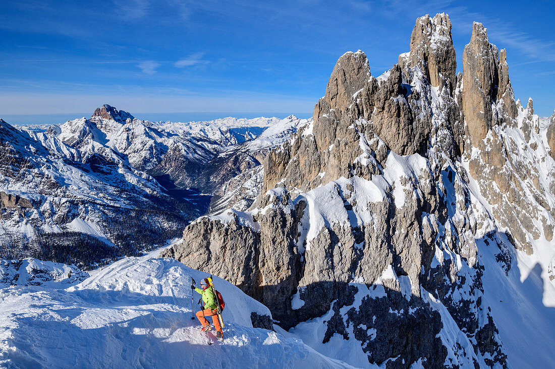 Woman on ski tour climbs into the Forcella del Nevaio, Cadini Group, Dolomites, Dolomites World Heritage Site, Veneto, Veneto, Italy