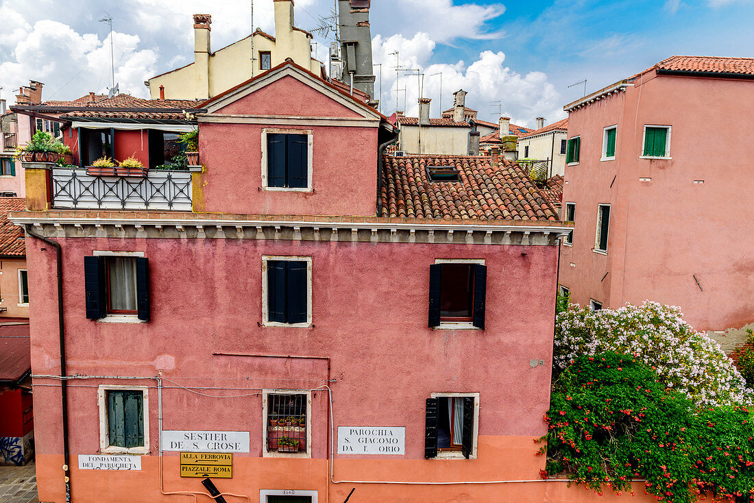 House with red facade, Venice, Italy