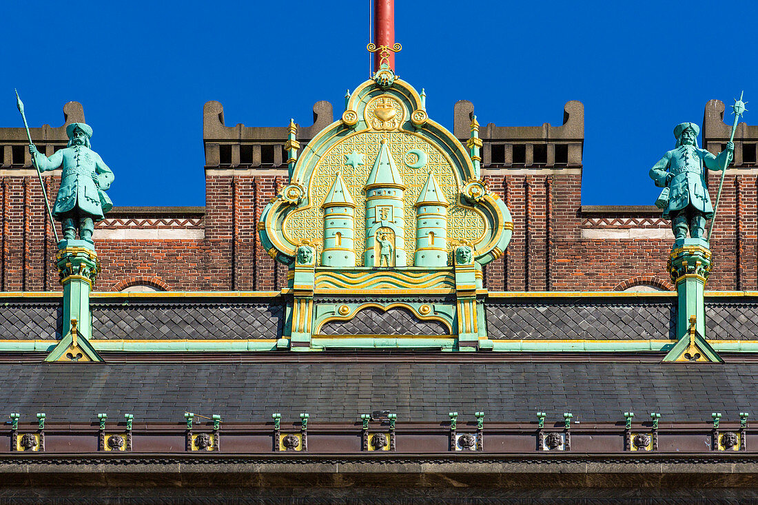 Detail of facade of Copenhagen City Hall (Kobenhavns Radhus), builded in 1905. Gold crest of Copenhagen, Copenhagen, Zealand, Denmark