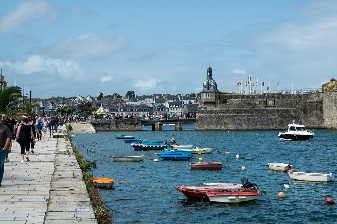 View from Quai Peneroff with people and colorful boats to Ville Close, Concarneau, Arrondissement Quimper, Departement Finistere, Brittany, France, Europe