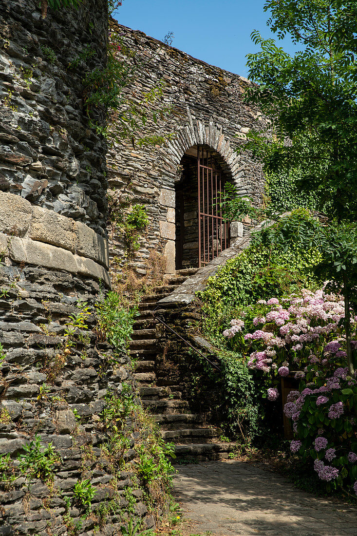 Enchanted staircase with an iron gate to the castle park of Rochefort en Terre, Morbihan department, Brittany, France, Europe