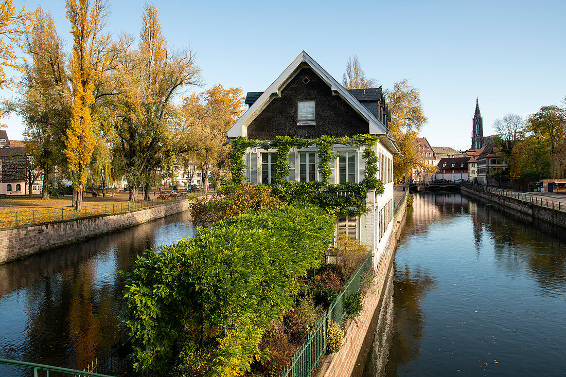 View from covered bridge (Ponts Couverts) to the idyllic Protection des Mineurs building, framed by canals in autumn, Strasbourg, Alsace-Champagne-Ardenne-Lorraine, France, Europe