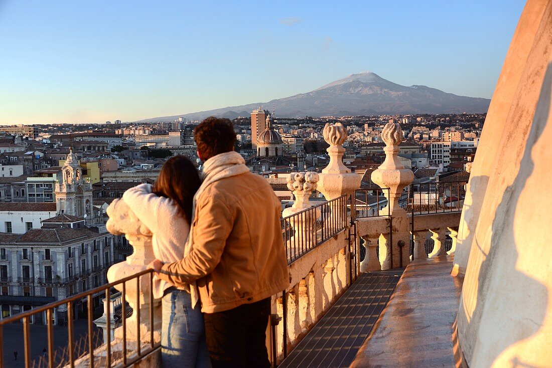 2 people on the church of Santa Agata with a view of Mount Etna, Catania, east coast, Sicily, Italy