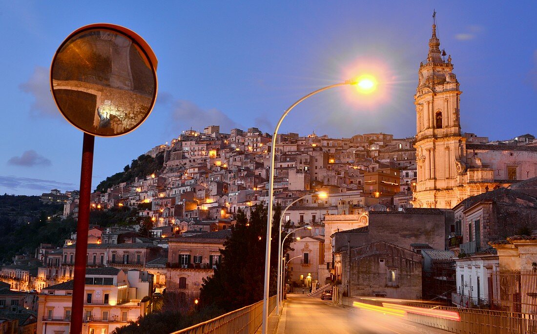 Evening, church, houses on the hill, lights on the Duomo, upper town of Modica, southern Sicily, Italy