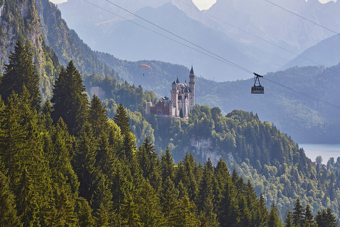 View of Neuschwanstein Castle, Alpsee, paraglider, cable car, Schwangau municipality, Ammer Mountains, Ostallg? U, Bavaria, Germany, Europe