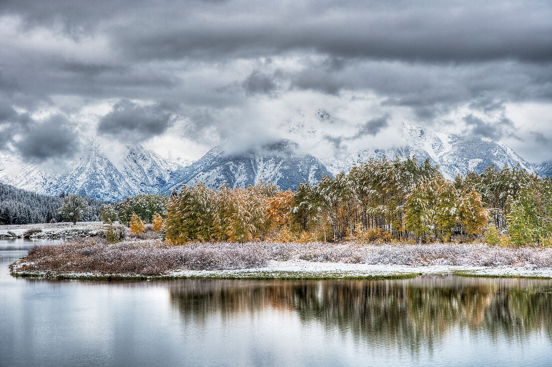 Oxbow Bend with Autumn (Fall) colour and early snow\nGrand Tetons National Park\nWyoming. USA\nLA006577