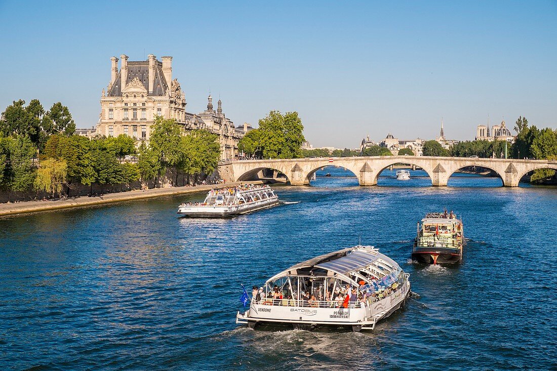 France, Paris, area listed as World Heritage by UNESCO, the river boats passing by the Louvre