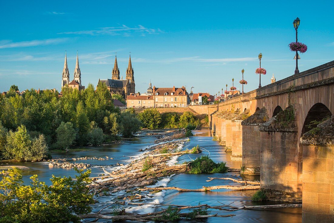 France, Allier, Moulins, view from the left bank of Allier river and Regemortes bridge, Sacred Heart church and Notre-Dame cathedral in the background
