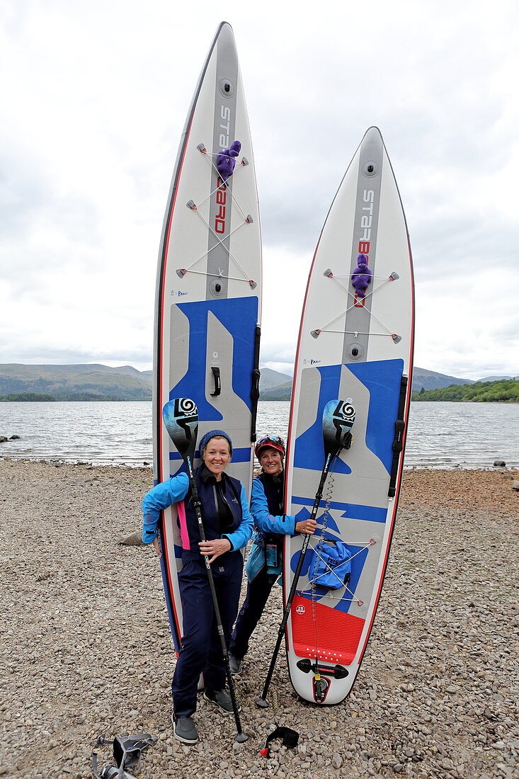 Stand-up paddle boarders at Loch Lomond, Highlands