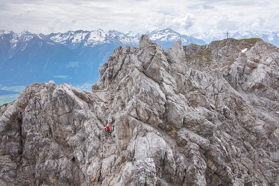 Man climbs on the rock in the via ferrata of the Wankspitze, Mieminger Kette, Tyrol