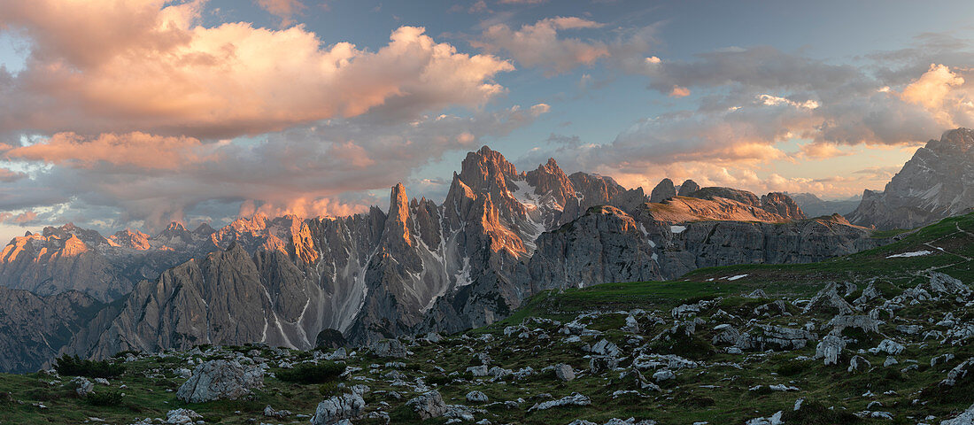 Panoramic mountain landscape with alpine glow in the Dolomites below the Three Peaks in the sunset, South Tyrol