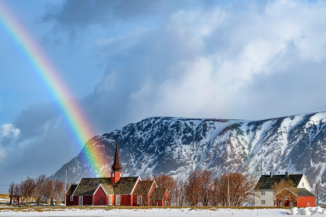 Rainbow over the church of Flakstad, Flakstad, Lofoten, Nordland, Norway
