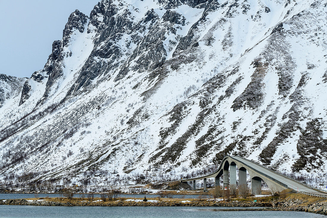 Curved bridge leads over estuary, Lofoten, Nordland, Norway