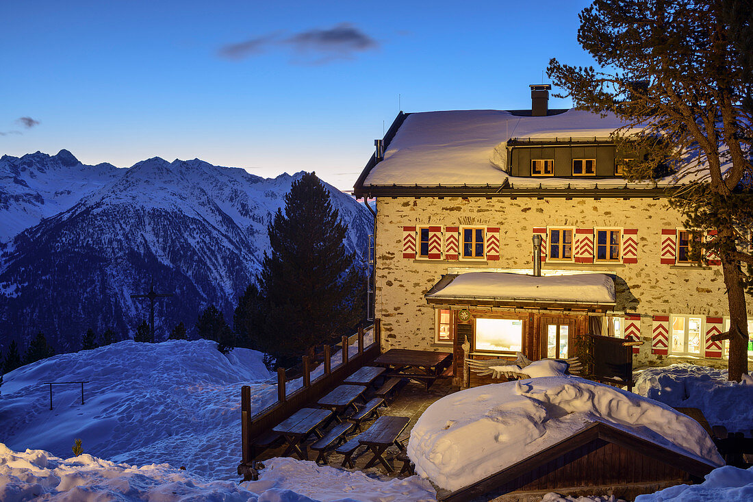 Illuminated Neue Bielefelder Hütte in winter, Ötztal Alps in the background, Neue Bielefelder Hütte, Stubai Alps, Tyrol, Austria
