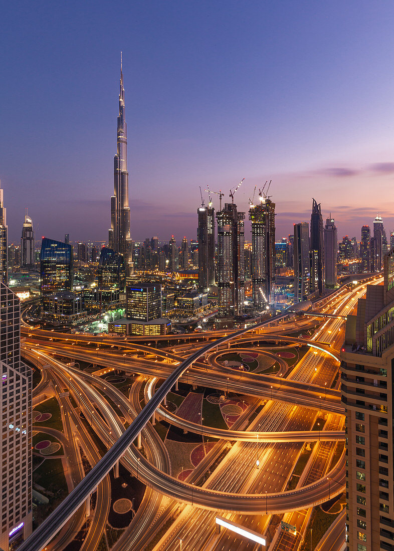 The illuminated city with the Burj Khalifa in Dubai, UAE