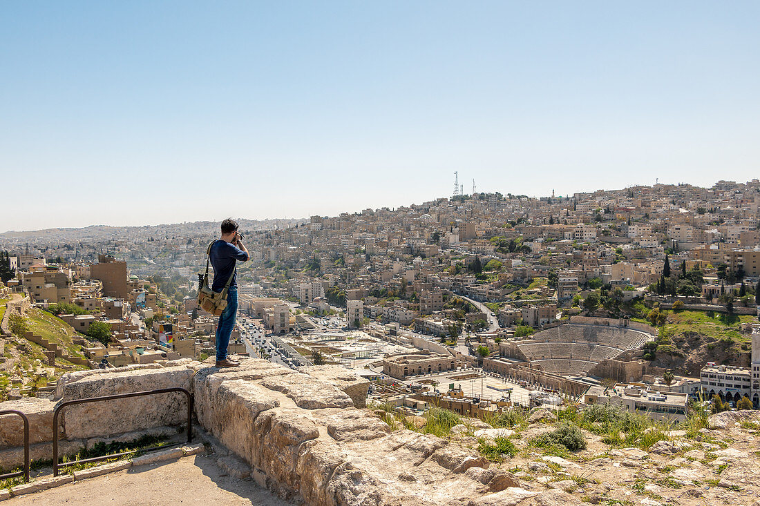 Tourist taking pictures of the city, Amman, Jordan