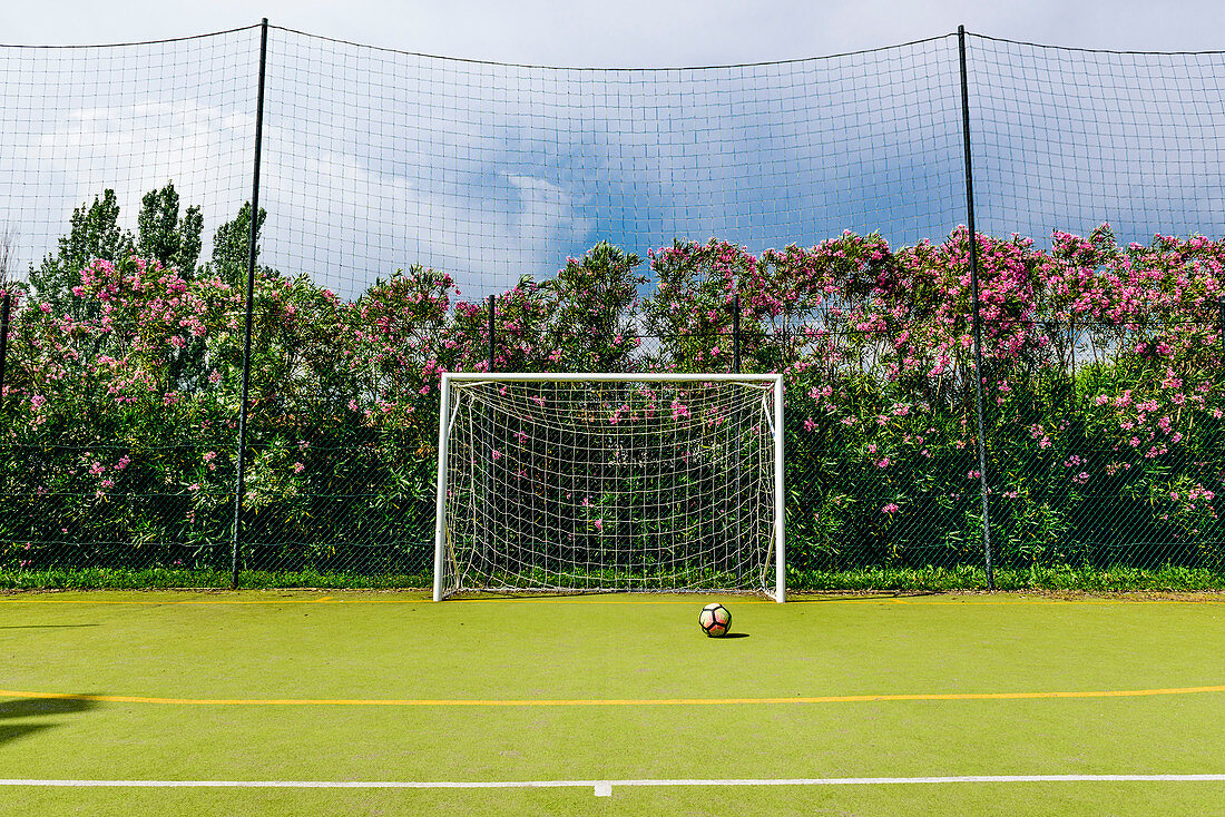 Sports field with soccer goal, Italy