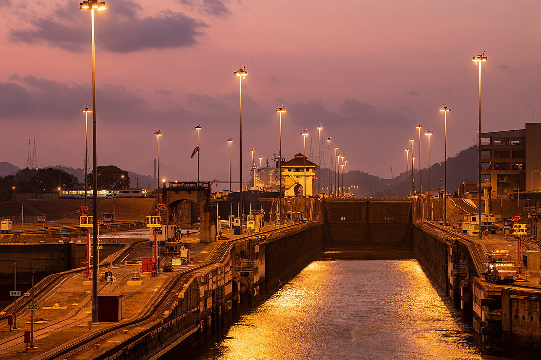 Early evening view of the approach to the Miraflores Locks in the Panama Canal, near Panama City, Panama, Central America