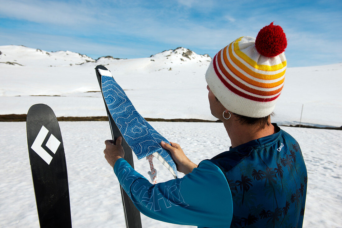 Putting on the skins in the Kosciuszko National Park, multi-day ski tour, NSW, Australia