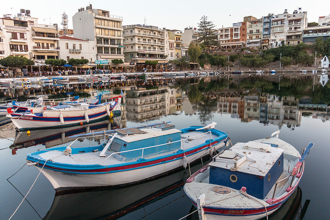 Boats in the lake of Agios Nikolaos - Limni Voulismeni in the evening, Crete, Greece