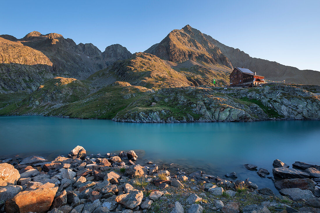 Turquoise Gradensee at the Nossberger Hütte at sunrise in the Gradental in the Hohe Tauern National Park, Austria