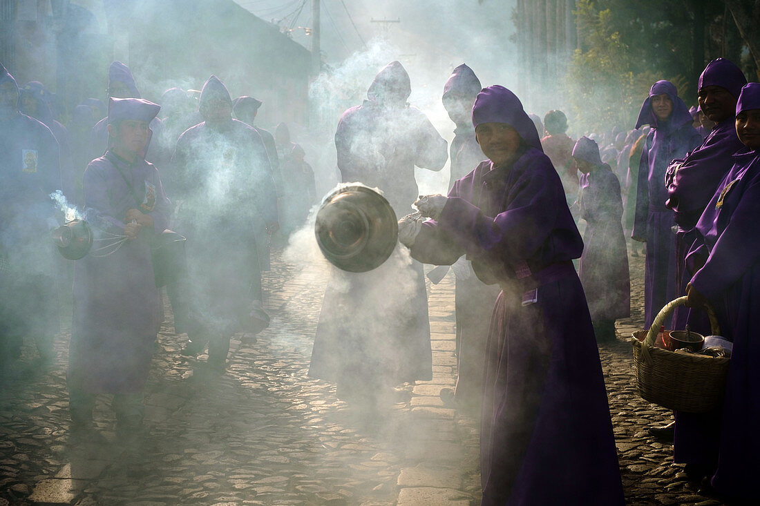 Guatemala, Antigua - March 3, 2013. A street is covered with the smoke of incense during procession for Semana Santa, the Holy Week, in Antigua. (Photo credit: Gonzales Photo - Flemming Bo Jensen).