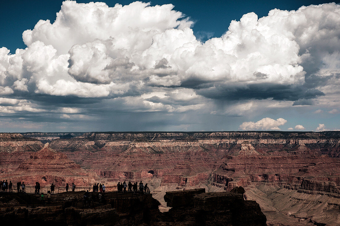 The Grand Canyon, USA - September 15, 2014. Tourists are overlooking the Grand Canyon mountain range.