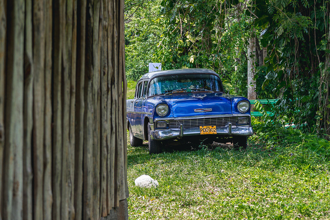 Parked blue classic car in Pinar del Rio, Cuba