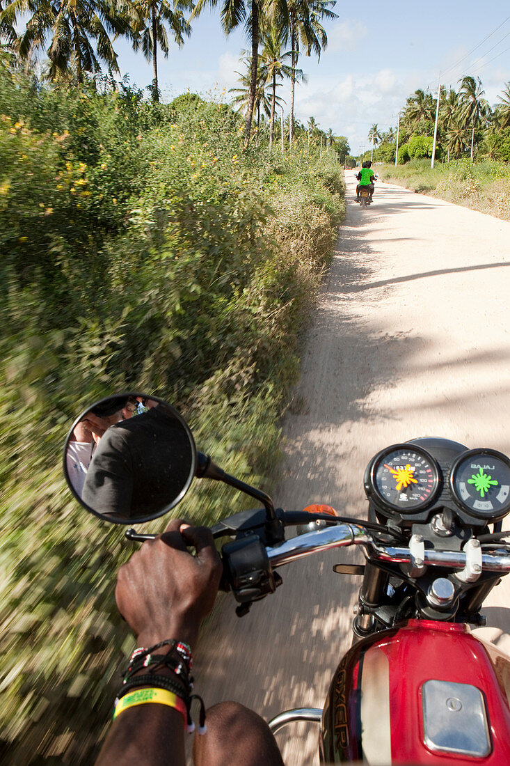 Motorbike taxi through the coconut plantations, Watamu, Malindi, Kenya