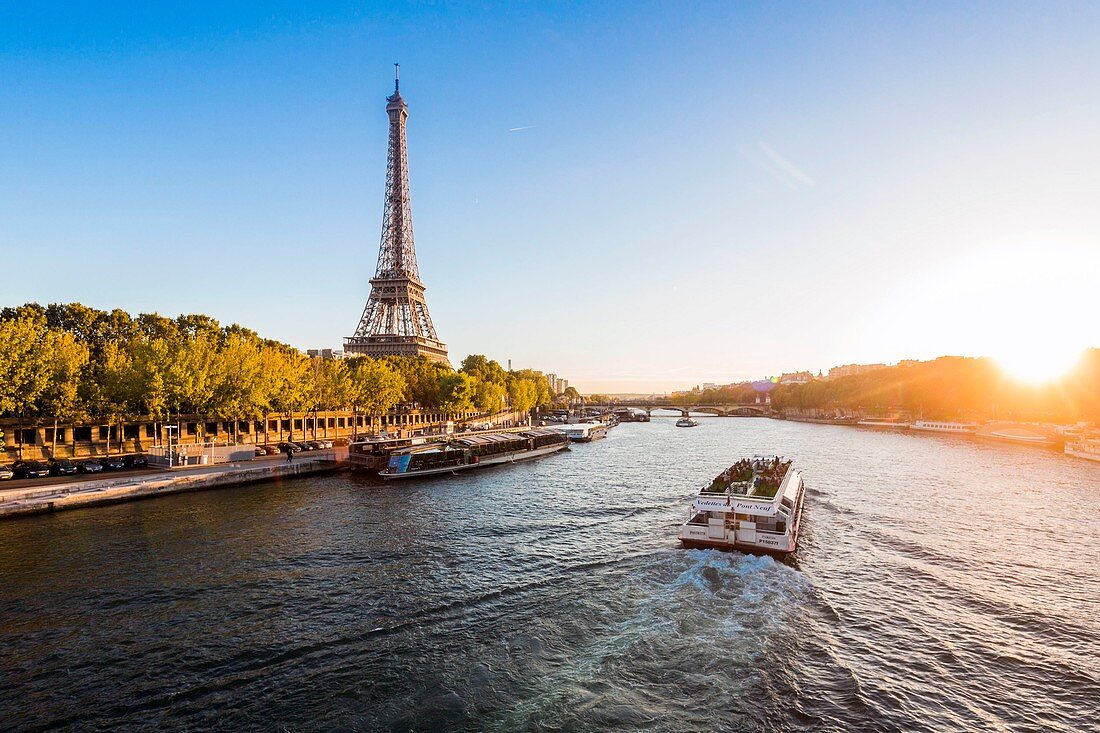 France, Paris, area listed as World Heritage by UNESCO, a boat and the Eiffel Tower