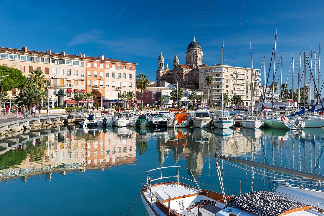 France, Var, Saint Raphael, old harbour and Notre-Dame de la Victoire basilica in the background