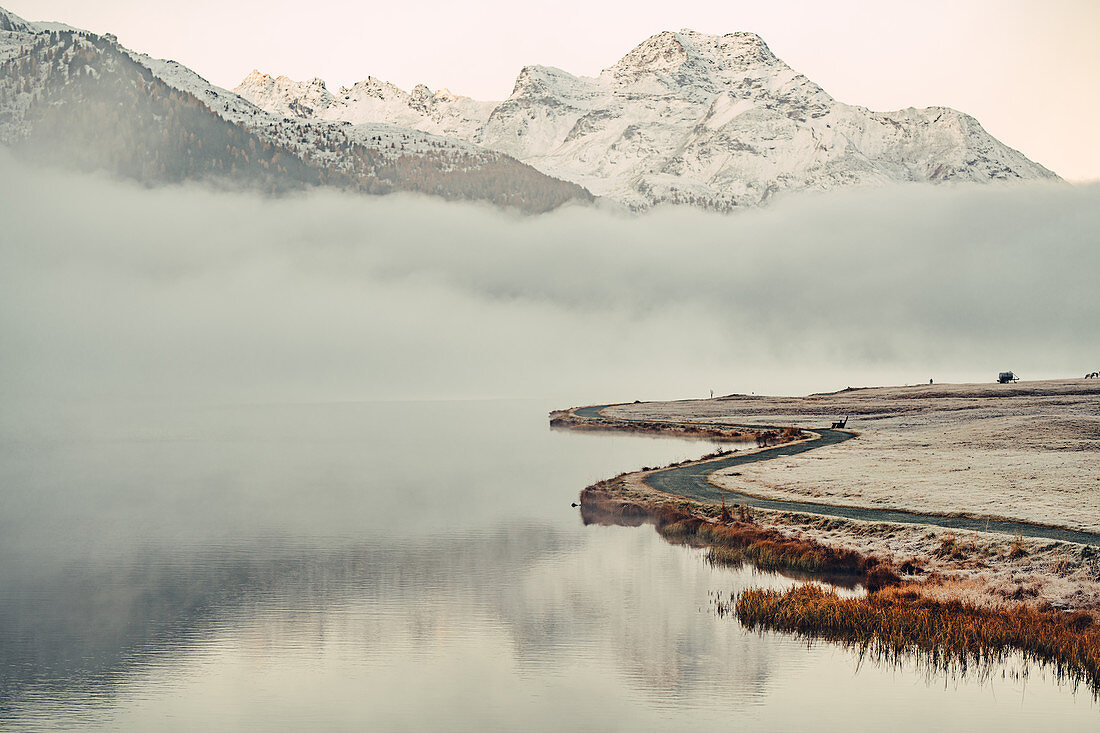 Lake Silvaplana at fog in the sunrise in the Upper Engadine, Sankt Moritz im Engadin, Switzerland