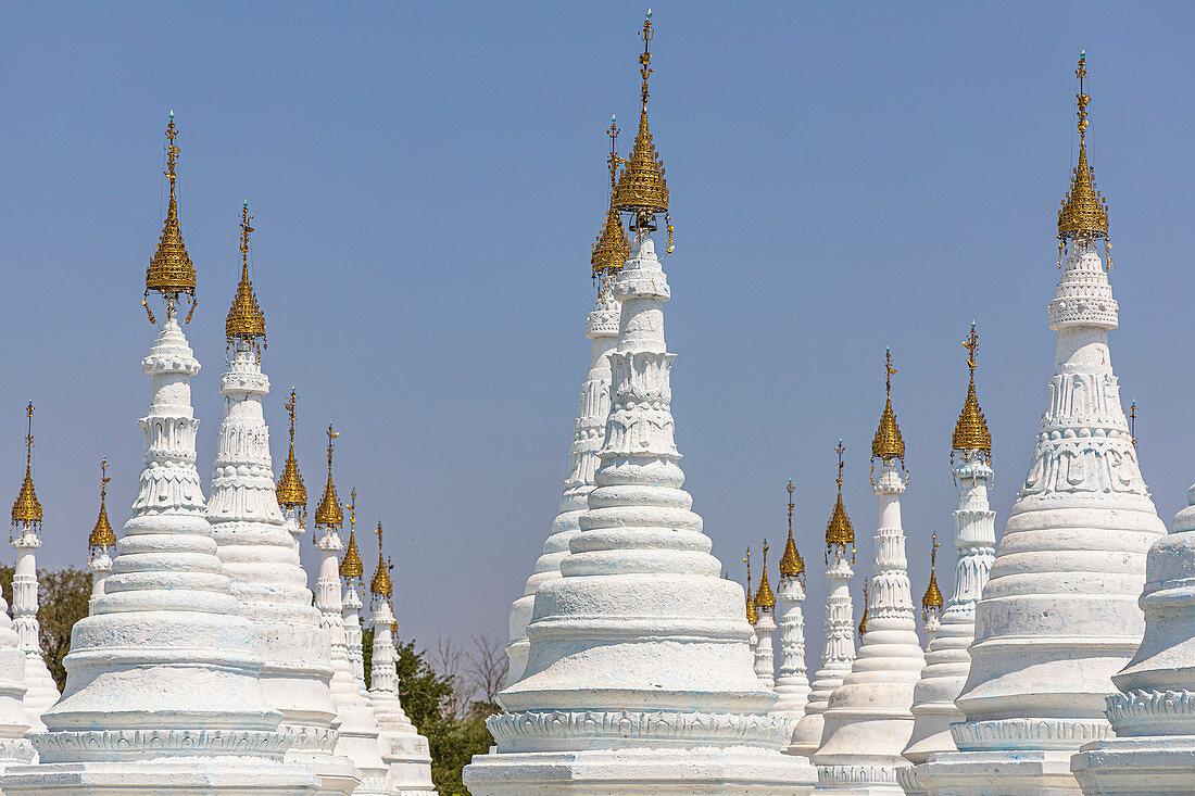 White stupas at famous golden Kuthodaw pagoda in Mandalay, Myanmar