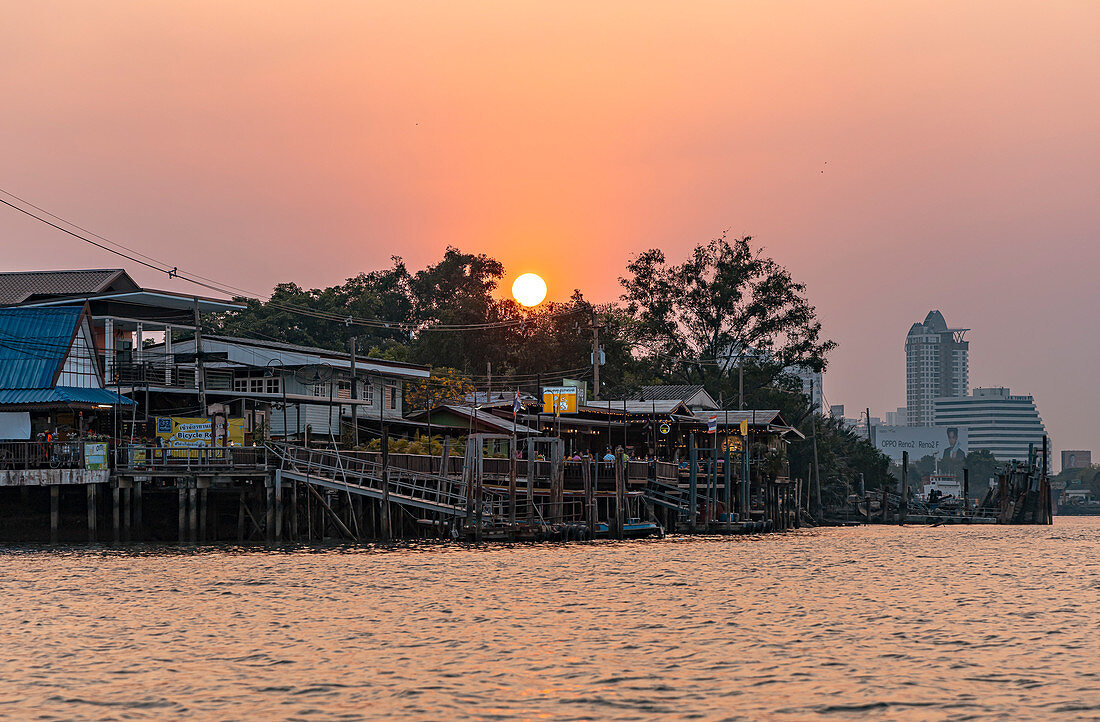 Sunset over Prapadaeng from the boat, Bangkok, Thailand