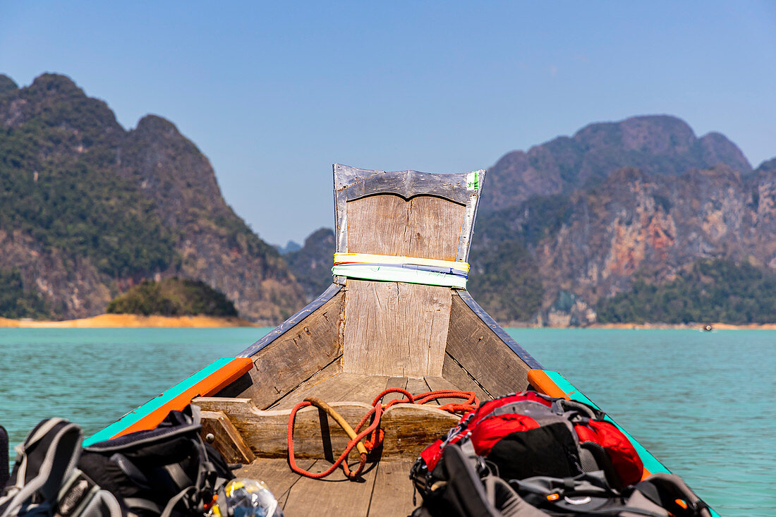 Longtail boat ride across Ratchaprapha Lake in Khao Sok National Park, Khao Sok. Thailand