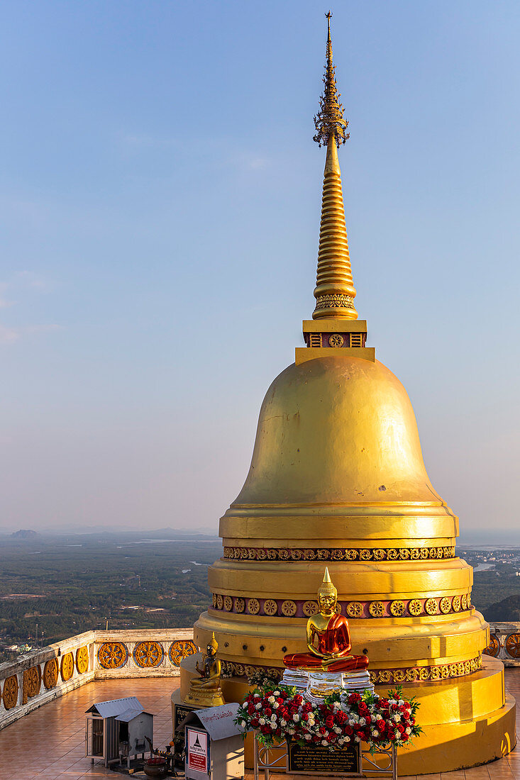 Golden pagoda on Tiger Cave Mountain in the evening light, Tiger Cave Temple, Krabi Town, Thailand