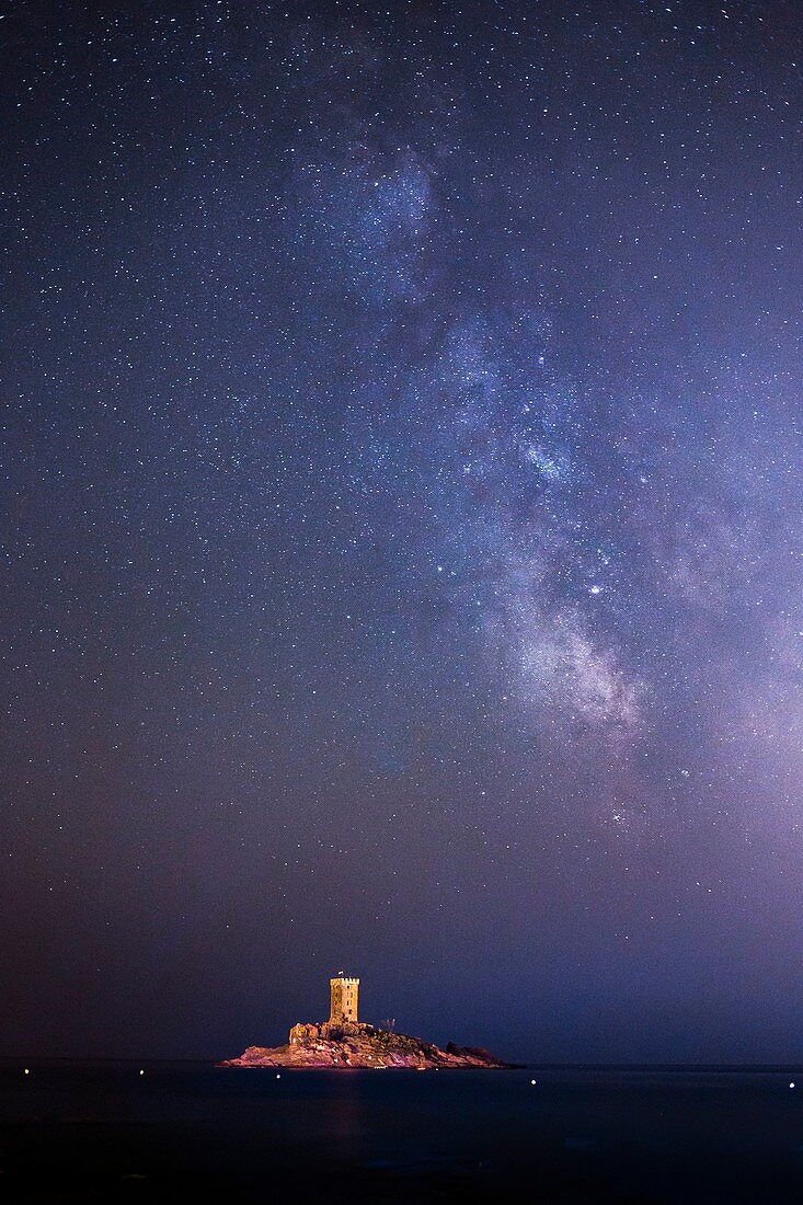 France, Var, Saint Raphael, Cap of Dramont, the tower of the ile d'Or under the Milky Way seen by the port of Poussai