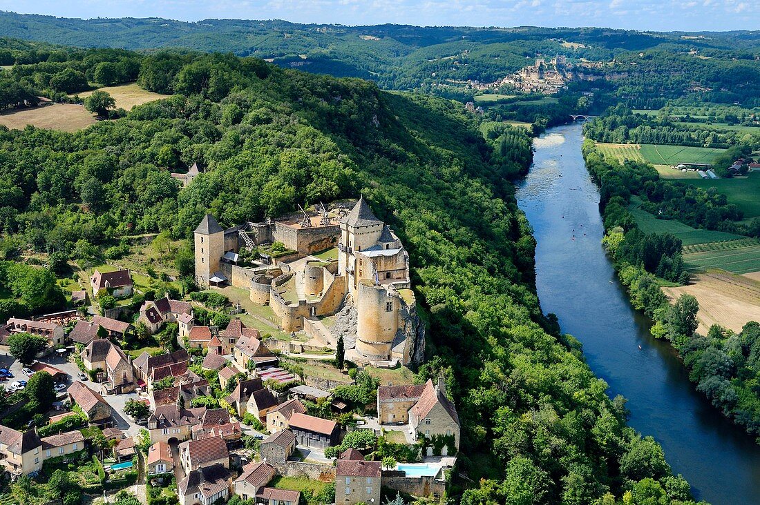 France, Dordogne, Perigord Noir, Dordogne Valley, Castelnaud la Chapelle, labelled Les Plus Beaux Villages de France (The Most Beautiful Villages of France), Castelnaud Castle on a cliff above the Dordogne valley (aerial view)