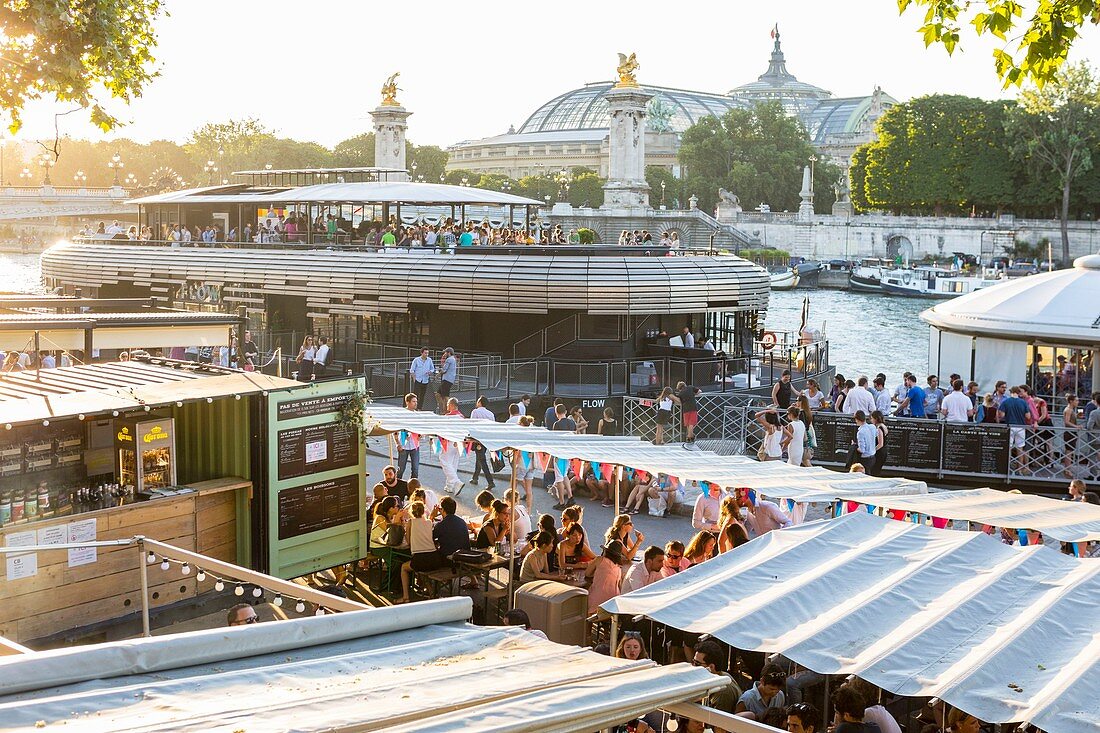 France, Paris, area listed as World Heritage by UNESCO, the New Berges at Quai d'Orsay with the bar barge Flow and the Alexandre III bridge