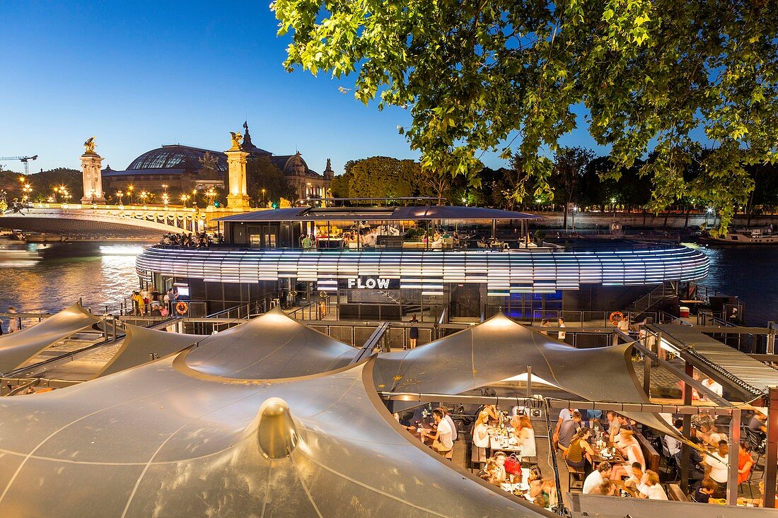 France, Paris, area listed as World Heritage by UNESCO, the New Berges at Quai d'Orsay with the bar barge Flow and the Alexandre III bridge
