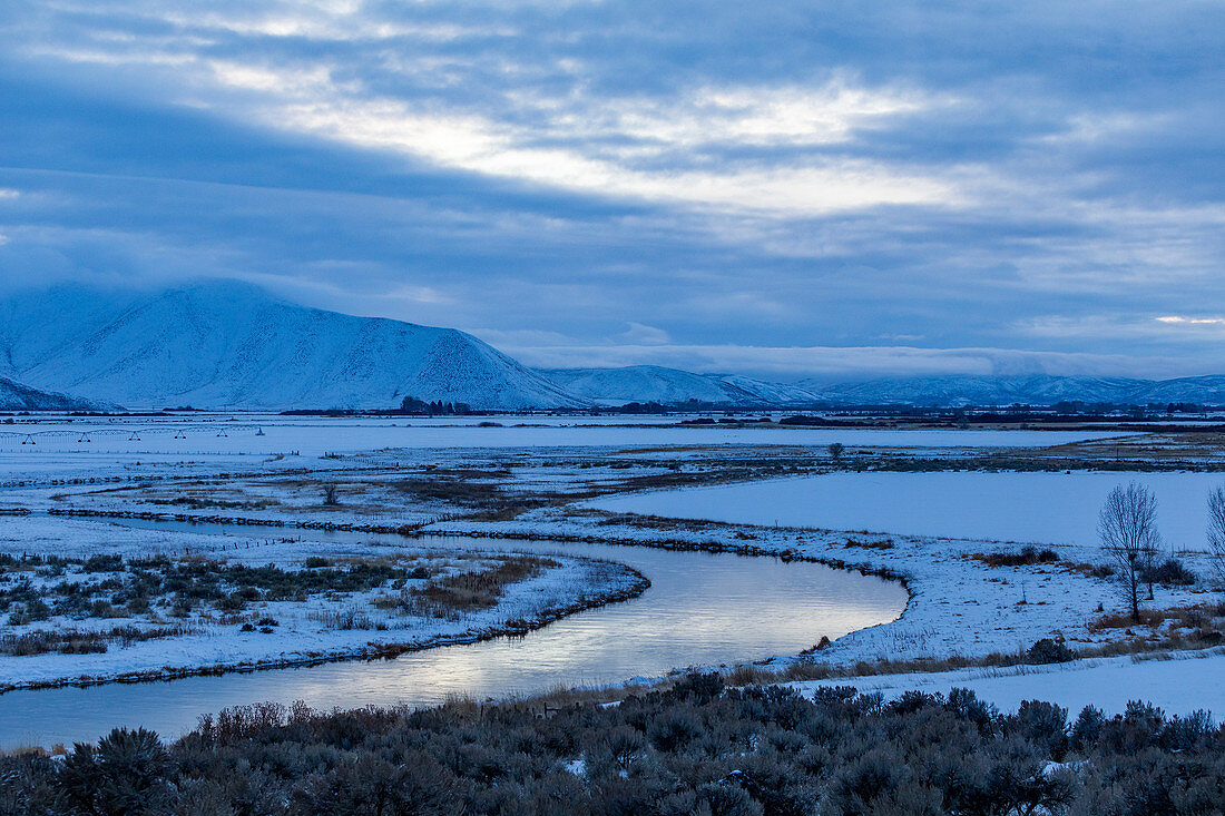 River by snowcapped mountain