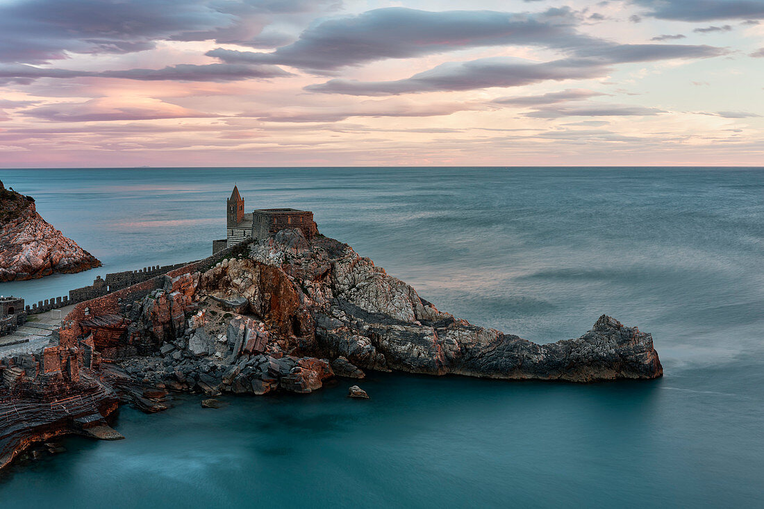 amazing coloured spring sunset at San Pietro Church, municipality of Portovenere, La Spezia province, Liguria, Italy, Europe