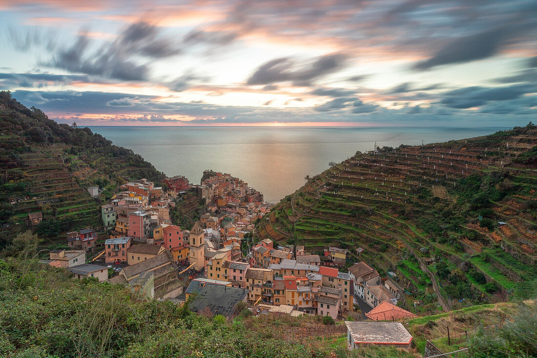 a long exposure to capture a magical sunset in Manarola, UNESCO World Heritage Site, National Park of Cinque Terre, municipality of Riomaggiore, La Spezia province, Liguria district, Italy, Europe