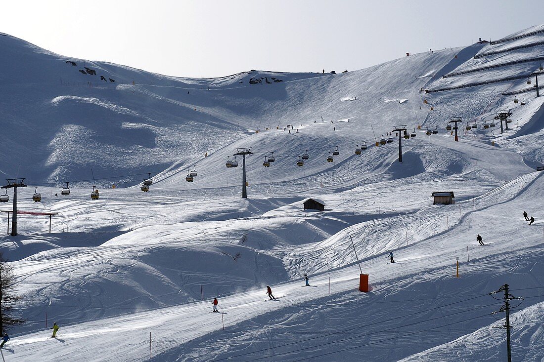 Ski slopes at the Pordoi Pass, ski lift, Dolomites, Trentino in winter, Italy